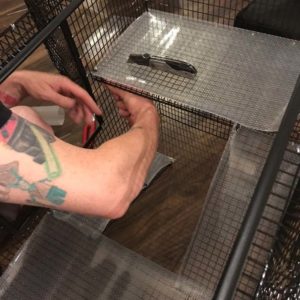 inserting liners on a wire cage floor