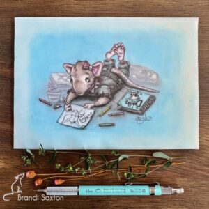 drawing of a rat in clothing lying on their tummy and sketching