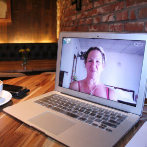 laptop with image of woman who is skyping