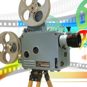 old reel-to-reel movie camera on graphic background of giant, colorful filmstrip