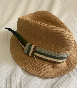 straw hat with feather