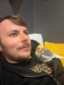 Paco-the-cockatiel-perches-on-man
