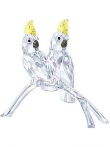 two crystal cockatoo figurines