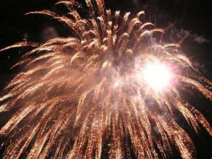 golden firework exploding in night sky