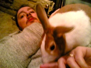 Shown here, a rabbit lightly nipping his human’s finger.